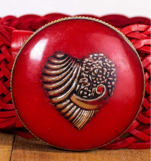 closeup red resin buckle with heart