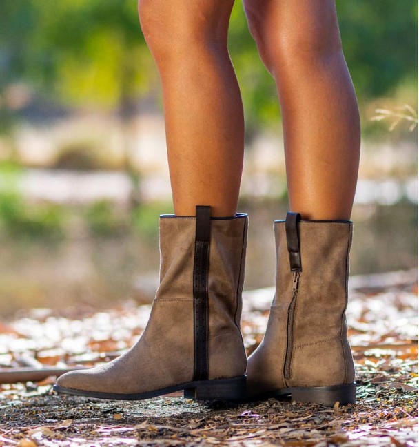 Side of Women's flat mid-calf cowboy boots in a rociero style, with leather strap on the side and handles.