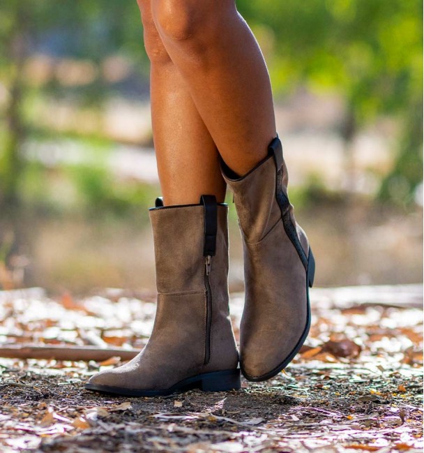 Front of Women's flat mid-calf cowboy boots in a rociero style, with leather strap on the side and handles.