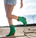 Women's green cowboy boots, low leg and Cuban heel. Textile material and zip. Embroidered in green thread
