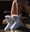 Beige australian boots without animal origin, fur inside and rubber sole. Side laces.
