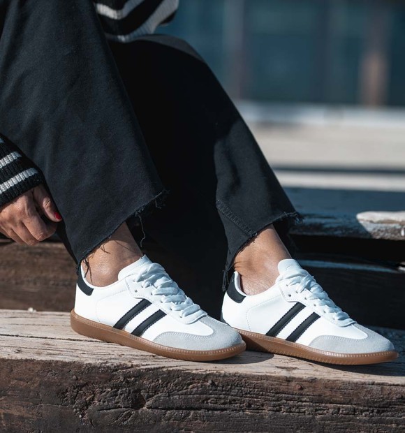 Combined sneakers in grey split leather, white leather and black lines. Brown rubber sole
