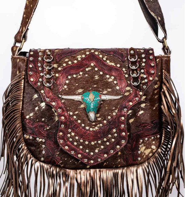 Bohemian style handbag in brown colt leather with gold spots and burgundy details.