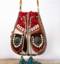 Bohemian bag with pockets, fringes, shells and beads. Pony skin and leather.