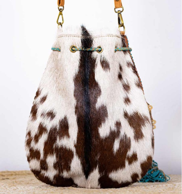 Bohemian bag with pockets, fringes, shells and beads. Pony skin and leather.