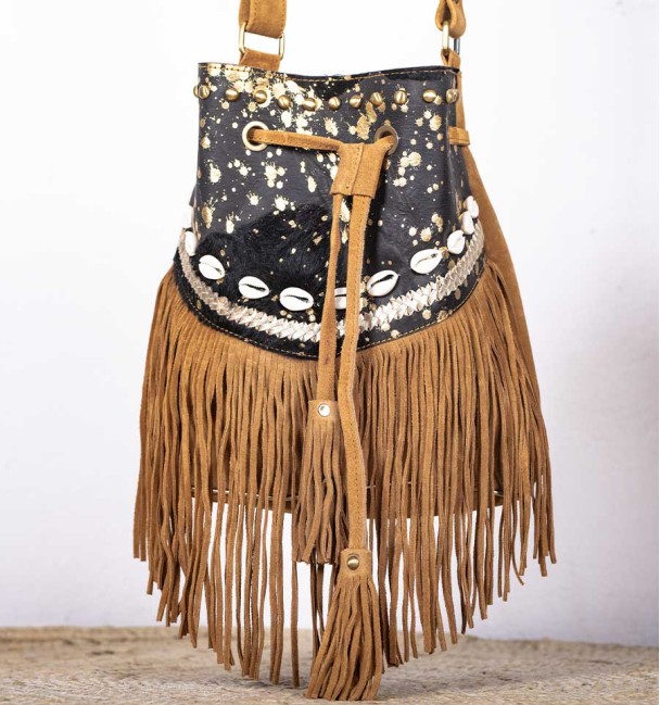 Bag type bag in leather and front pocket in black and brown colt leather. Bronze piece and stone in the centre