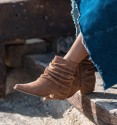 Brown ankle boots in brown made of suede-like fabric. Low heel and inner zip