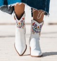 women's cowboy boots in white leather, half shaft and wooden heel, colourful embroidered flowers.
