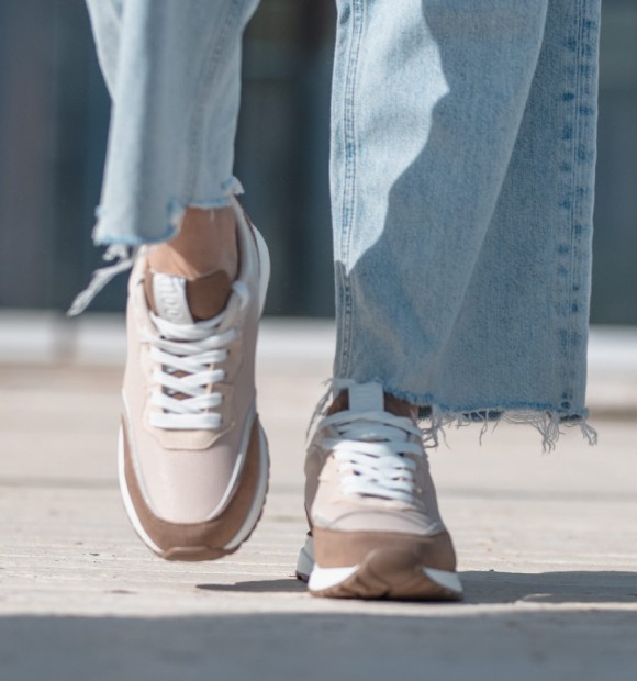 running trainers in beige, silver and white. Animal free 2