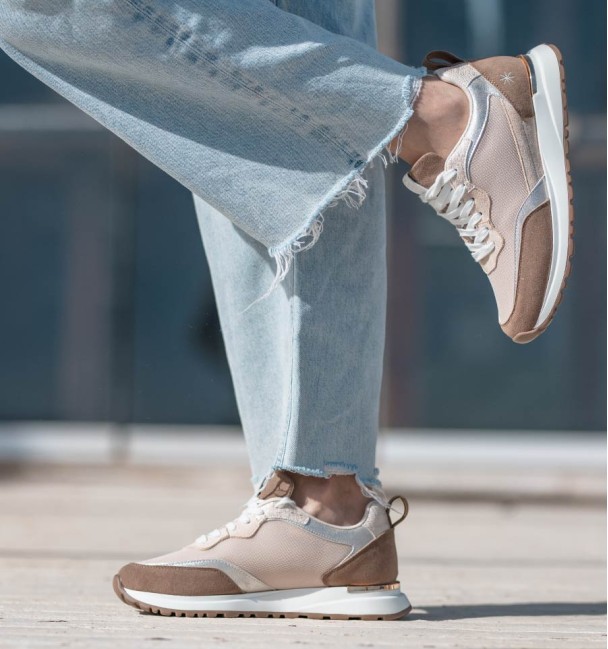 running trainers in beige, silver and white. Animal free