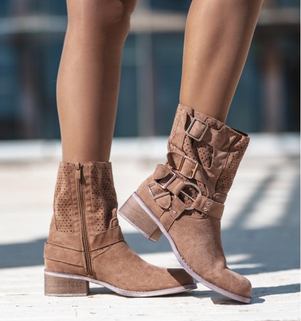 brown coloured cowboy boots with buckles and die-cut mid-calf. Animal free