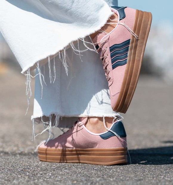 pink textile trainers with double brown rubber sole and 4 blue stripes. Animal free.