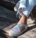 silver espadrilles with crossed elastic straps on the instep and original woven toe cap. Animal free