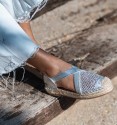 silver espadrilles with crossed elastic straps on the instep and original woven toe cap. Animal free