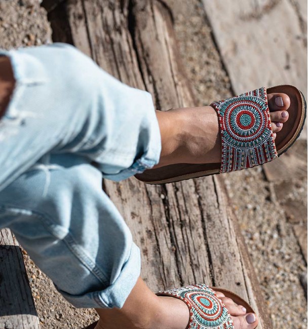 flat sandals with bio sole and beaded uppers. rubber sole.