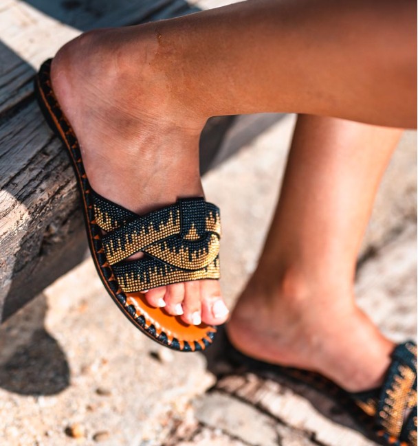 flat sandals  in orange and black beads cross straps. Vegan flats