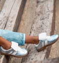 Silver trainers with white tongue and two white stripes on the sides. Trendy women's trainers. Animal free