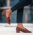 low heel moccasin shoes with leopard print and burgundy border and tassels. Animal free.