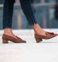 low heel moccasin shoes with leopard print and burgundy border and tassels. Animal free.