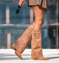 Women's brown high boots with flap and heel. Strap and padlock on the top