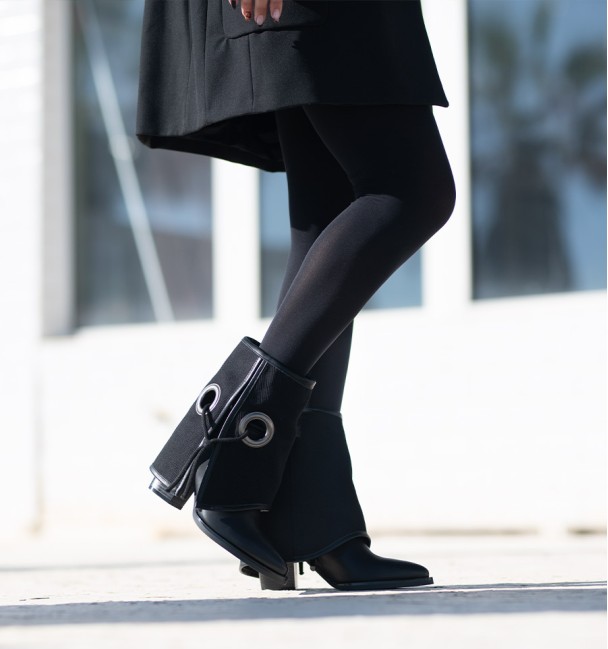 Black low top boots in black eyelet gaiter with black lacing. Wide heel and pointed toe finish. Black low top boots in black eyelet gaiter with black lacing. Wide heel and pointed toe finish.