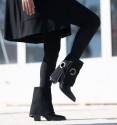 Black low top boots in black eyelet gaiter with black lacing. Wide heel and pointed toe finish.