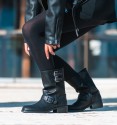 Black mid-calf boots with buckles. Inner zip and flat. Vegan