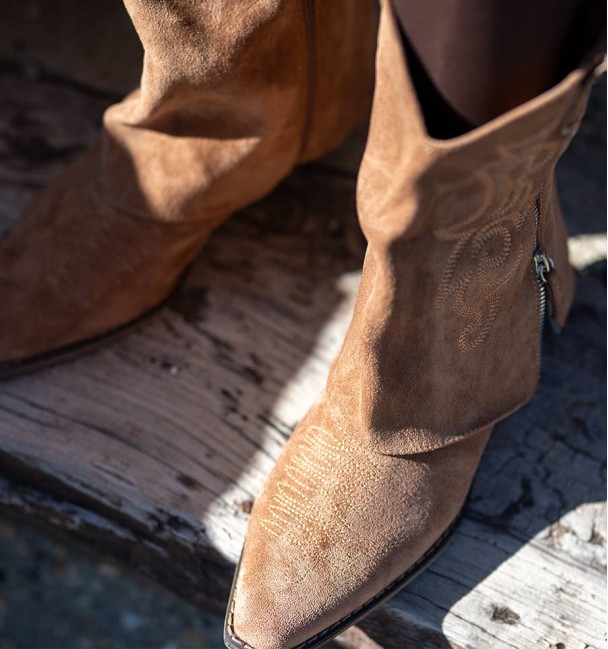 Camel half-calf boots with embroidered flap and external decorative zip and wood effect cube heel.