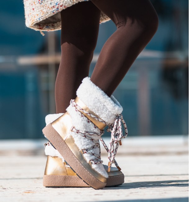 Botas de esqui apres douradas