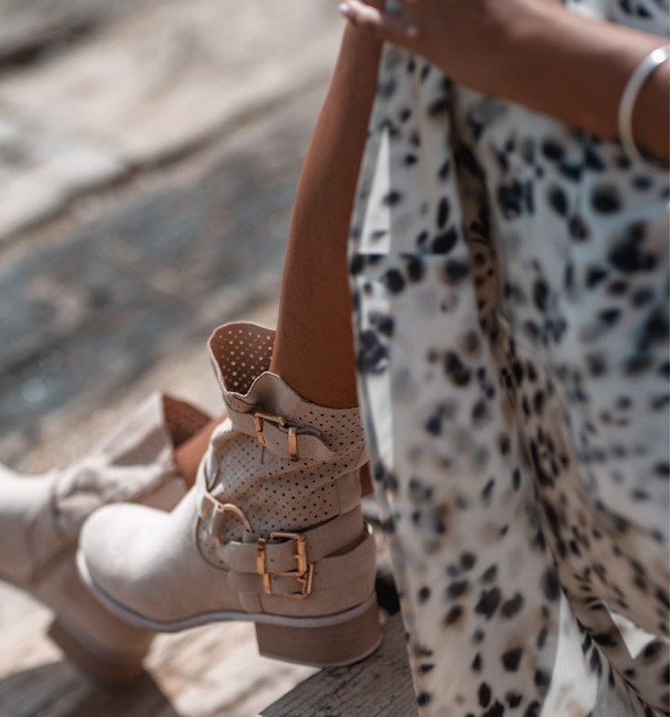 beige coloured cowboy boots with buckles and die-cut mid-calf. Vegan