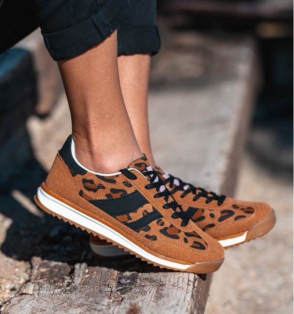 Trainers leopard and black stripes with white sole.