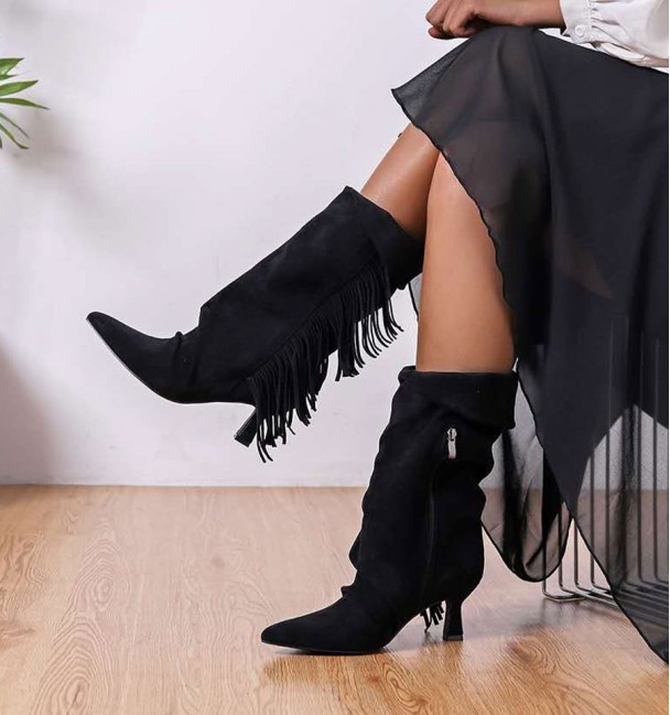 Black boots with lapels, fringes, and heels