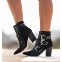 heeled boot with buckles and studs